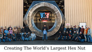 Employees surrounding the world's largest hex nut